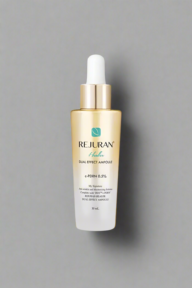 Rejuvenating serum bottle with gold cap on a white background