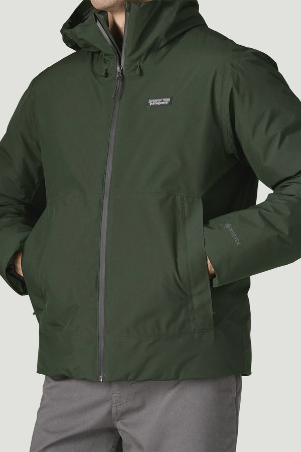Green jacket with a brand logo on a gray background