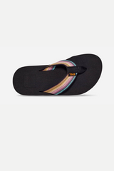 A kid's sandal with a black upper and multicolored strap, featuring a white EVA-foam outsole.