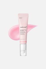 Pink skincare tube with a pink smear on a white background
