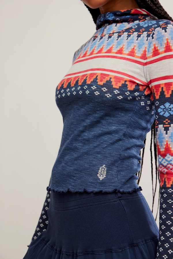Navy blue top with colorful pattern on a plain background