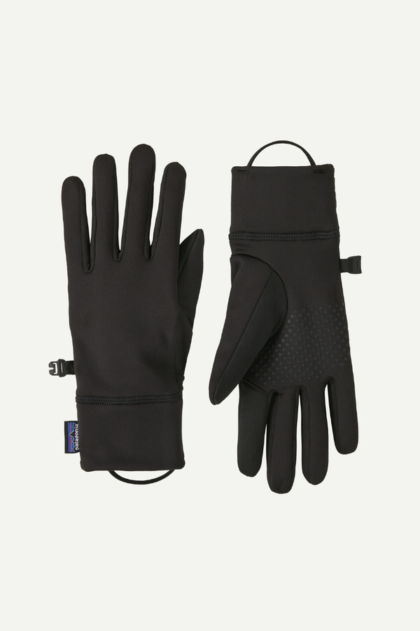 Pair of black gloves on a light gray background