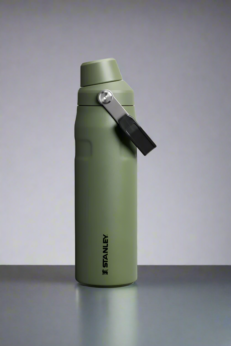 Green Stanley water bottle on a light gray background