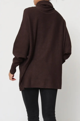 Brown oversized sweater worn by a person on a white background