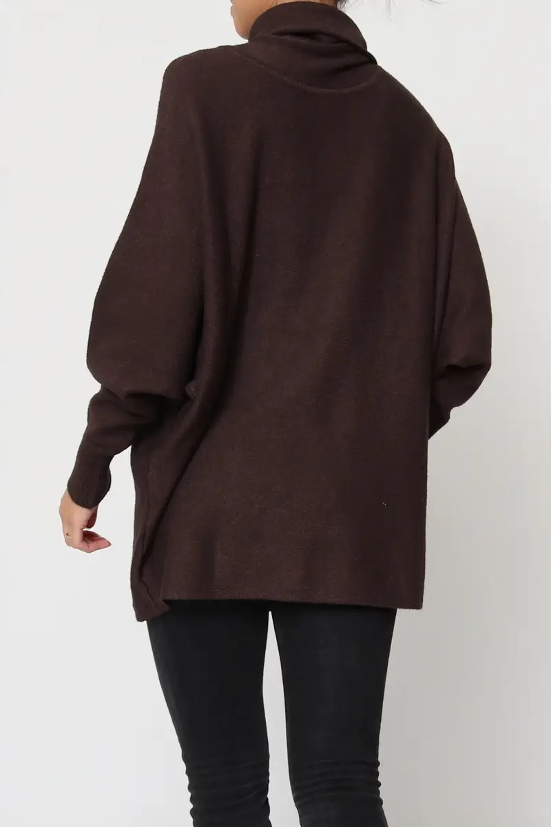 Brown oversized sweater worn by a person on a white background