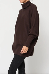 Brown oversized sweater worn by a person on a white background