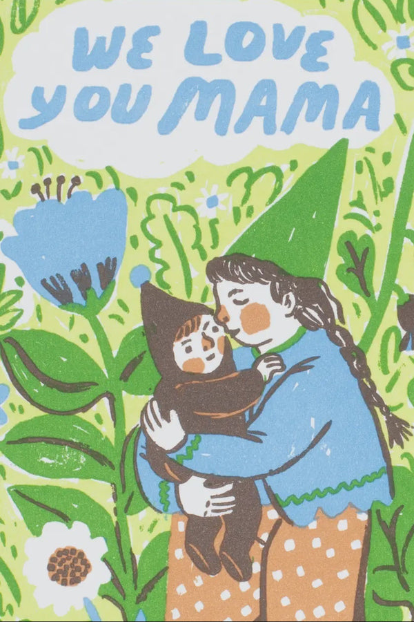 Card with illustration of a woman holding a child surrounded by flowers and text 'WE LOVE YOU MAMA'.