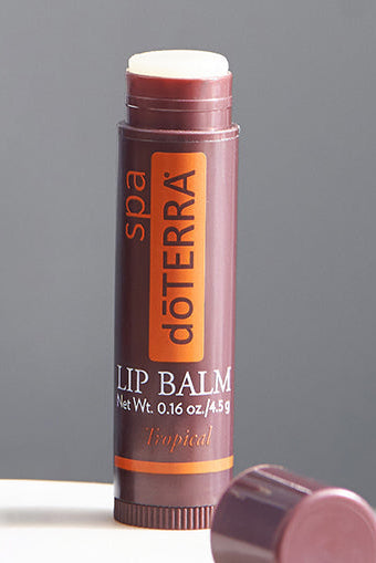 doTERRA lip balm on a gray background